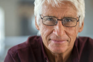 an older man wearing glasses